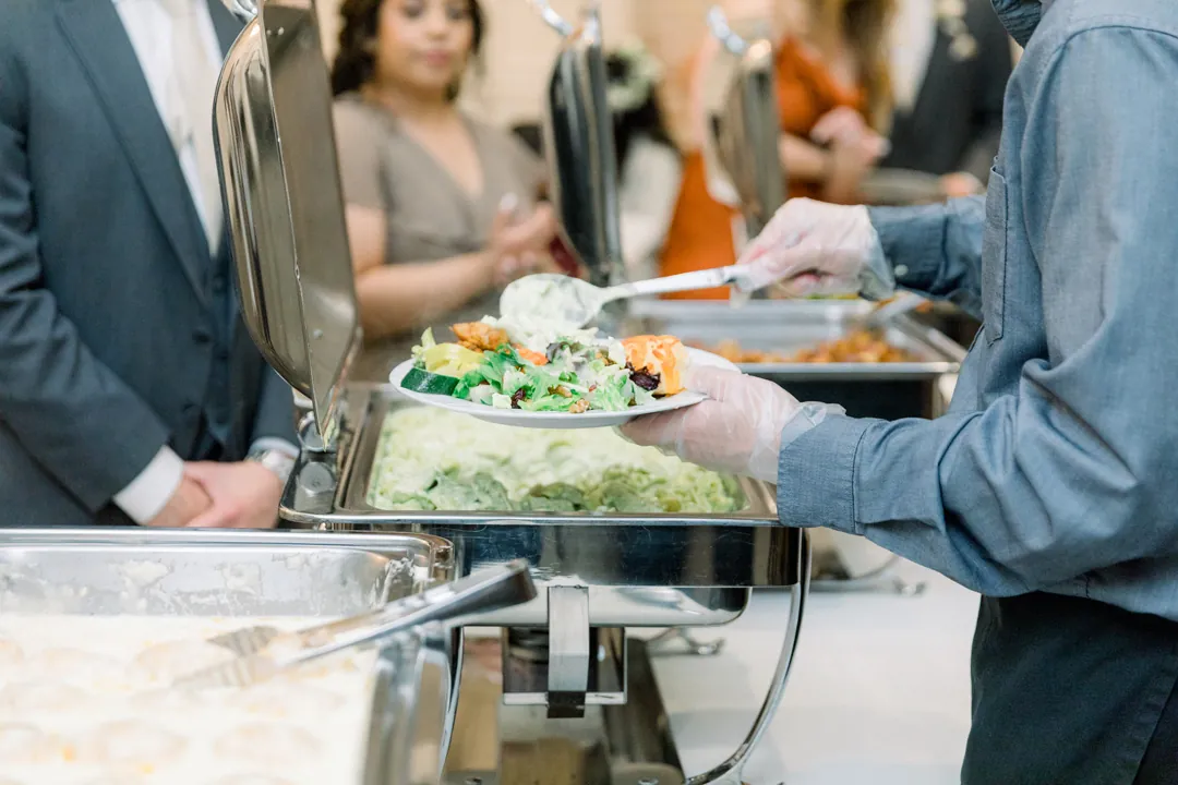 Guests selecting food at a buffet