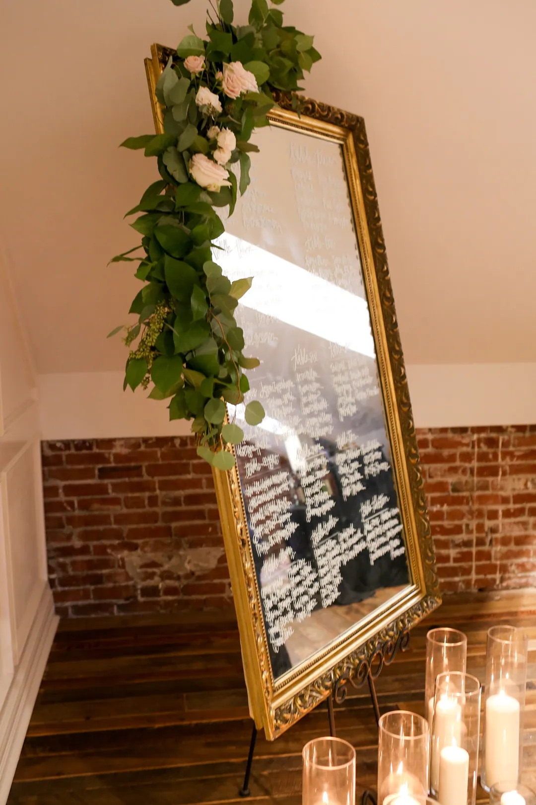 Framed seating display decorated with trailing greenery.