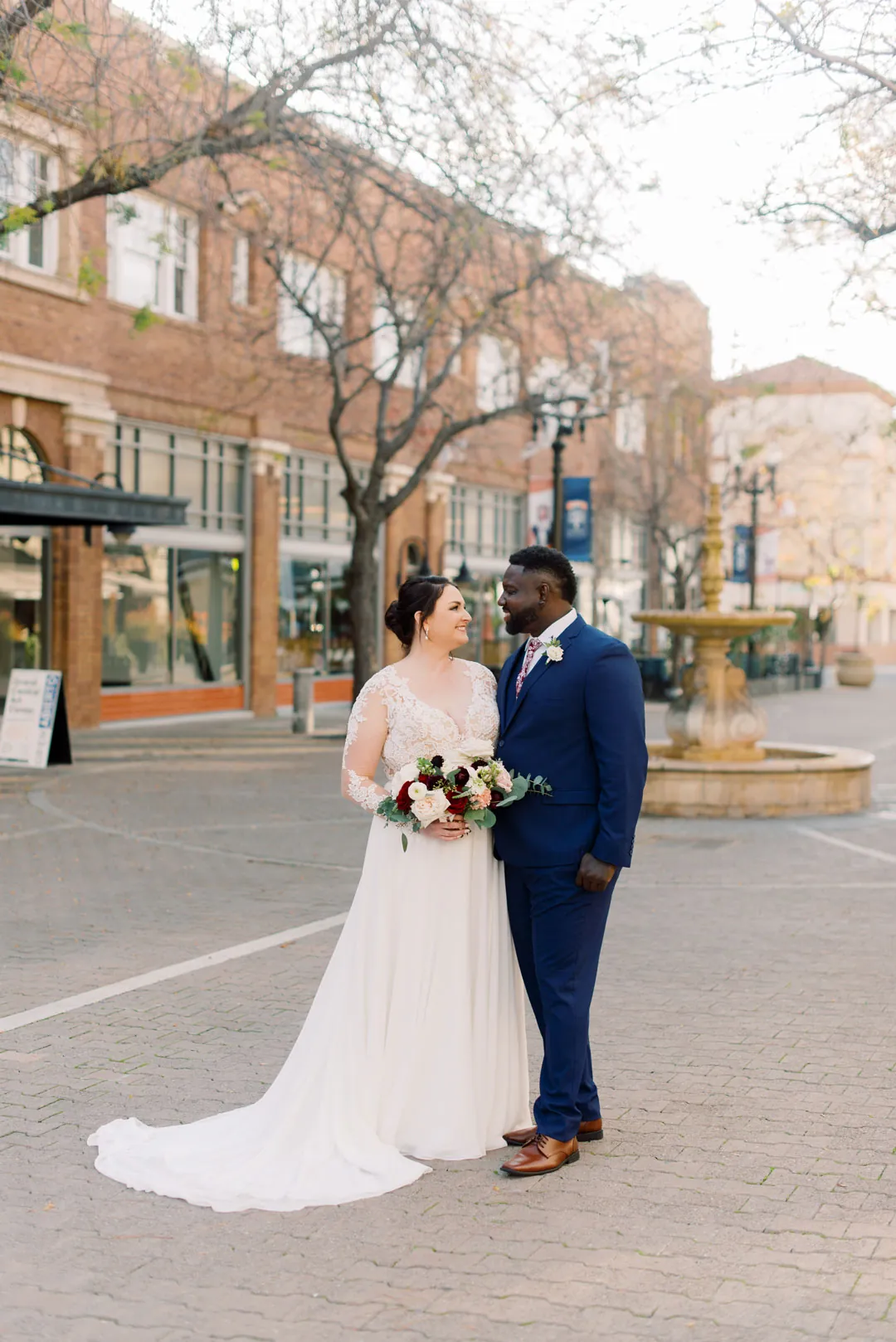Couple standing together on a city street
