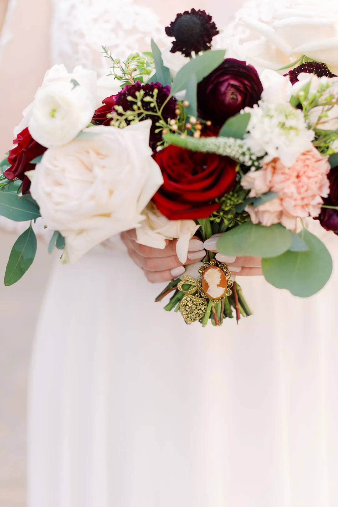 Bridal bouquet with red, white, and pink flowers