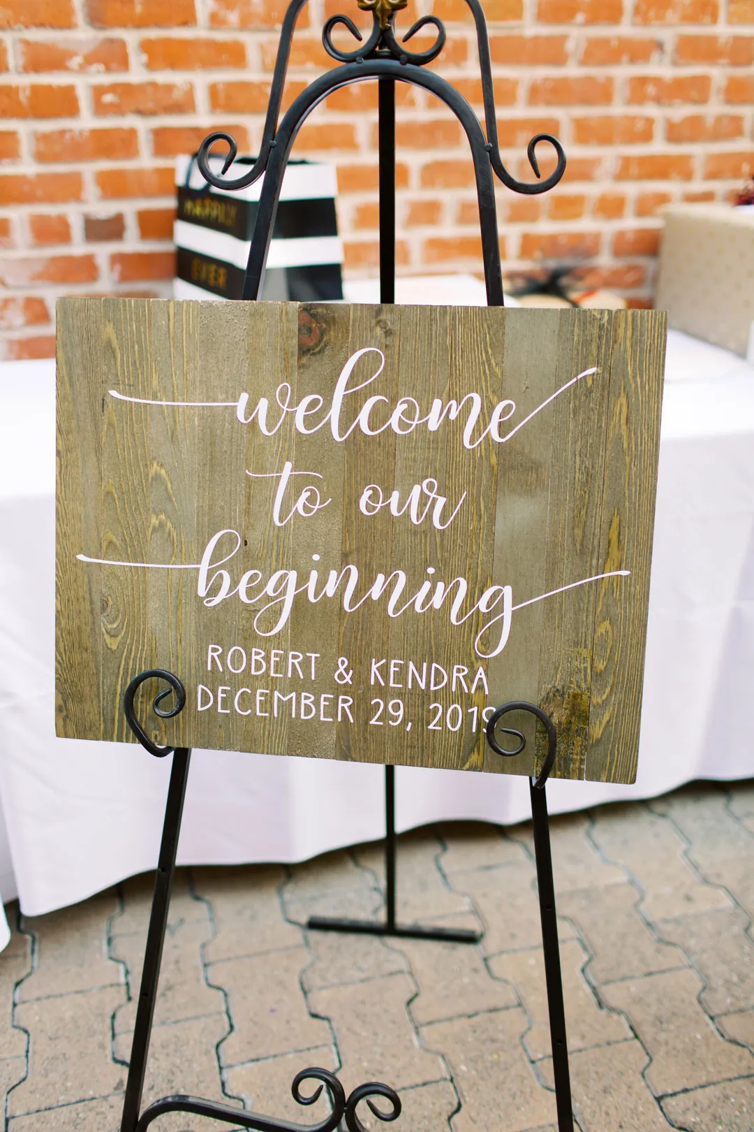 Wedding welcome sign displayed on a metal easel
