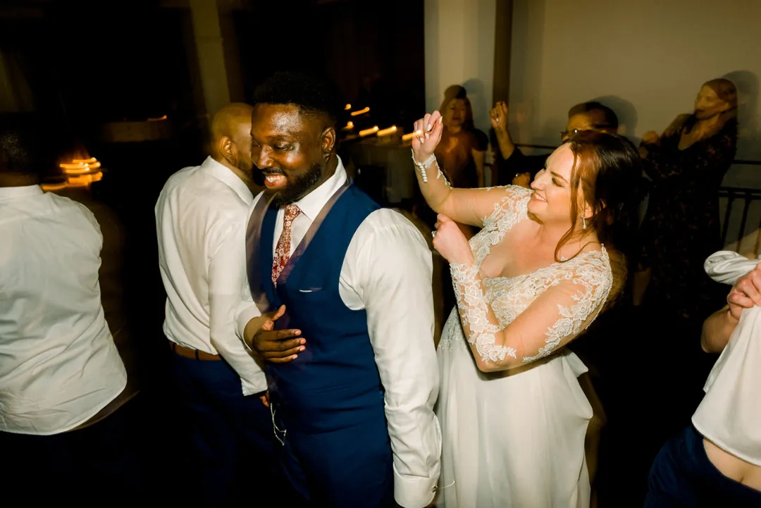 Couple celebrating together on a crowded dance floor