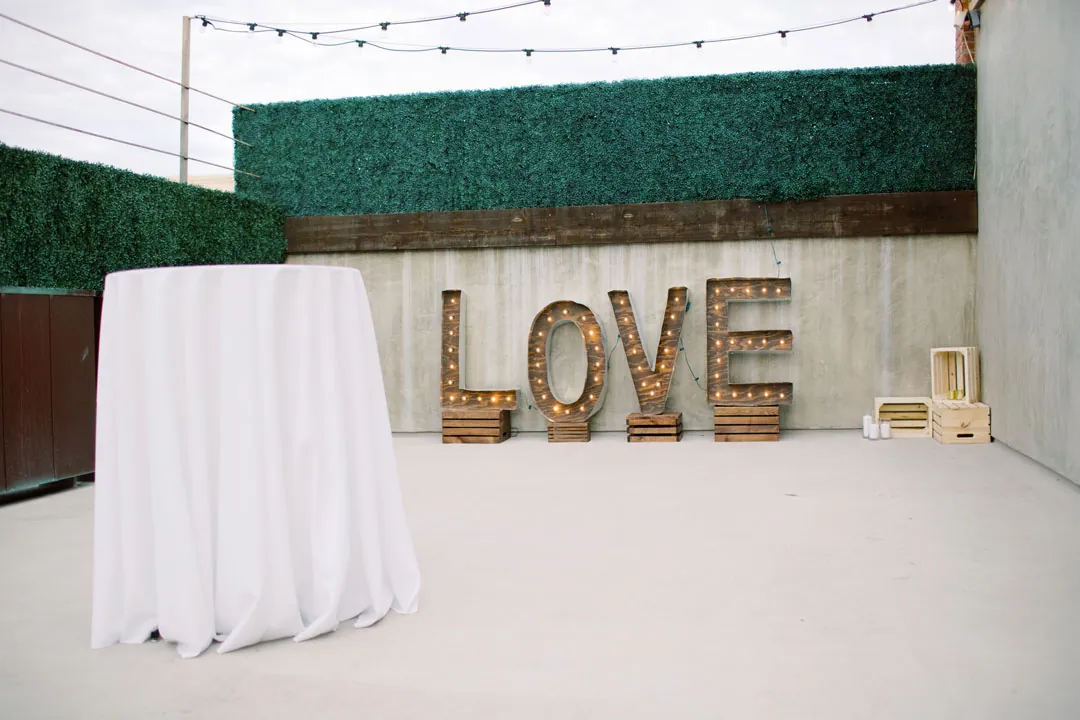 Outdoor cocktail terrace with large wooden LOVE letters