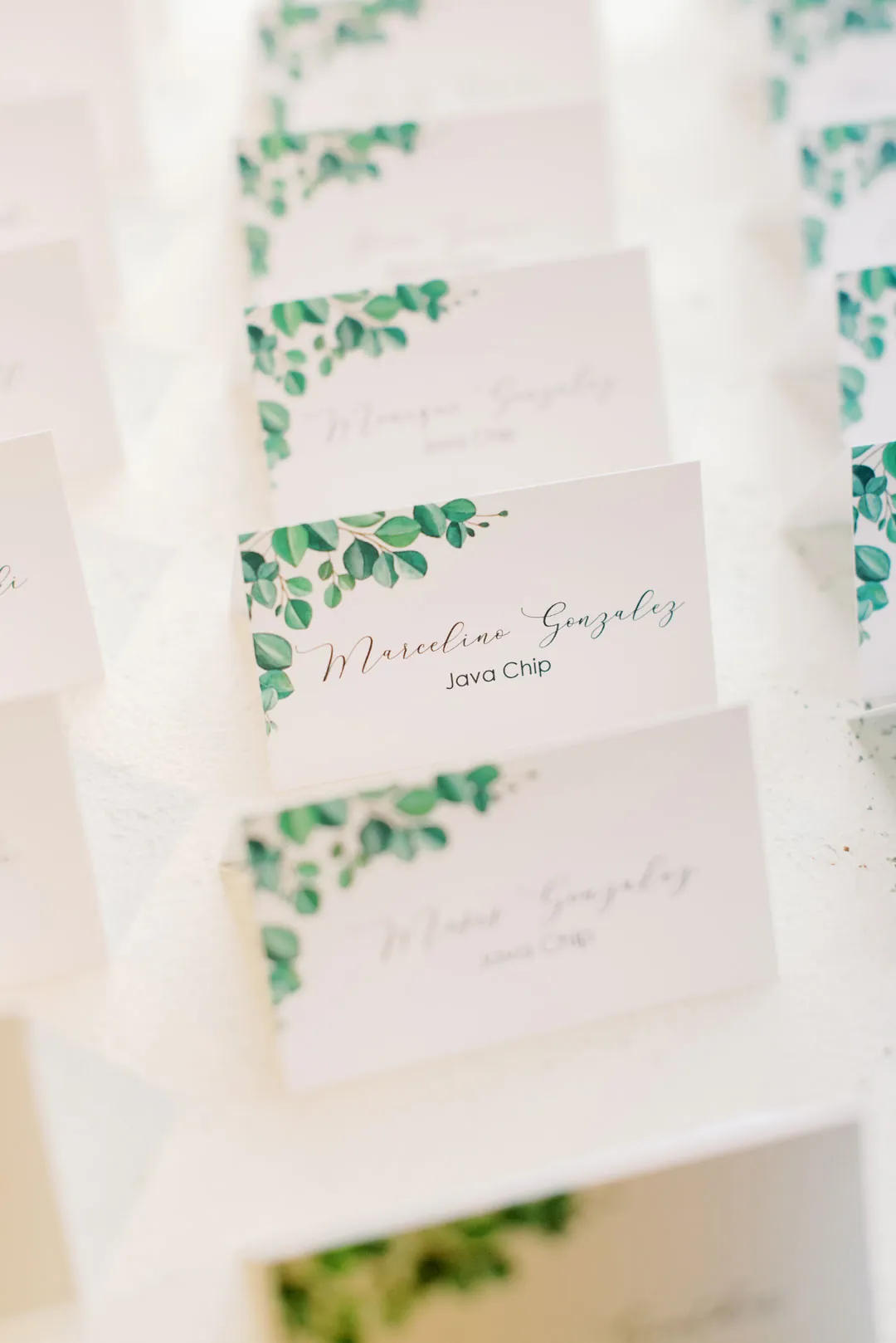 Small wedding favor cards decorated with greenery