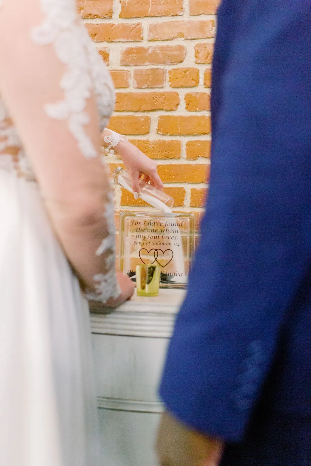 Couple holding hands during their wedding ceremony