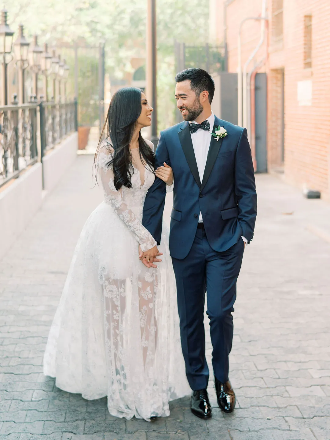 Couple walking together along a city sidewalk