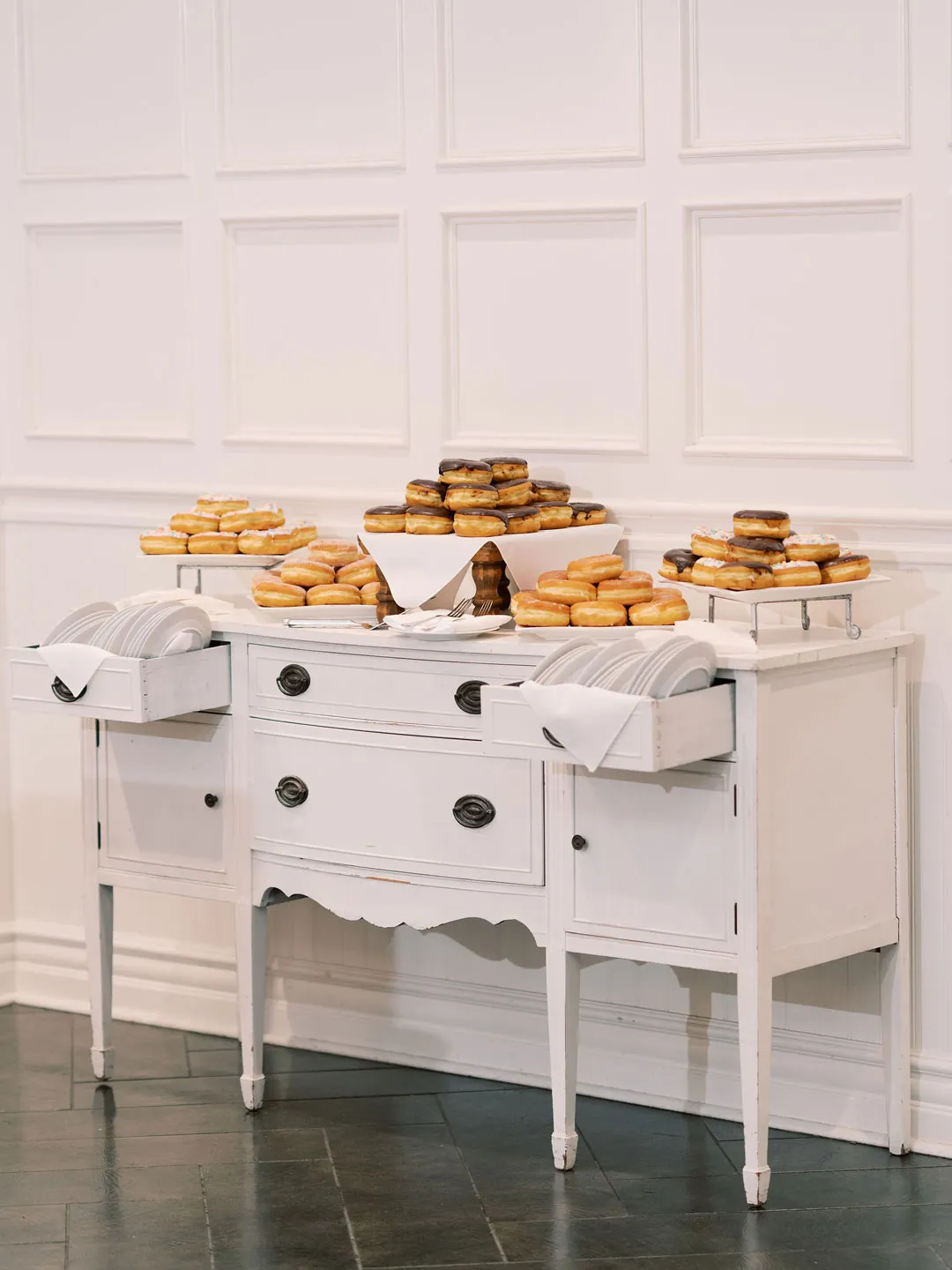 Assorted desserts displayed on a white dresser