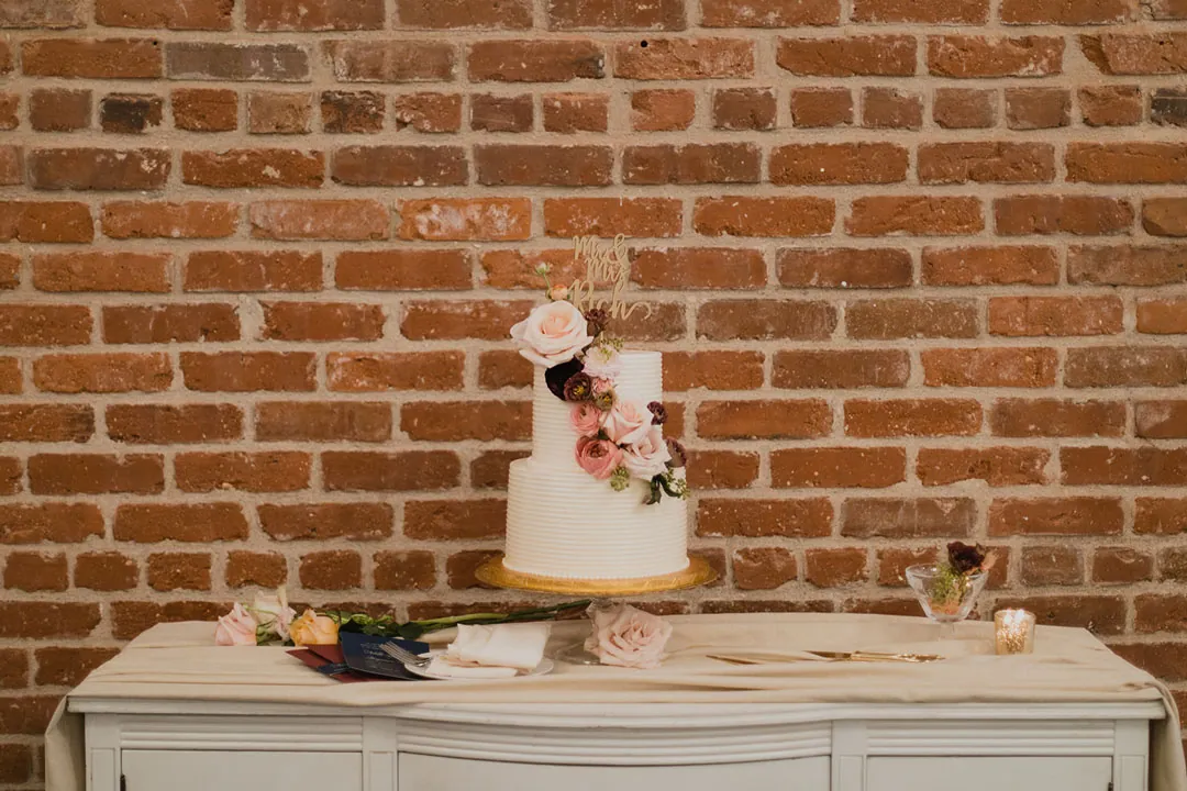 Cake and glassware displayed on a white dresser