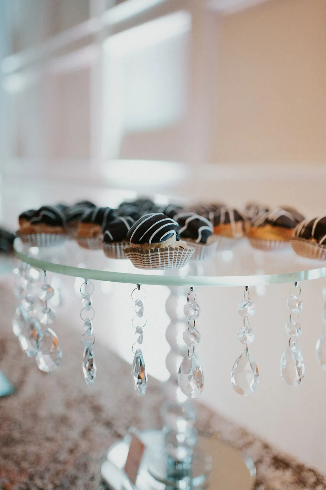 Small desserts on a glass display stand