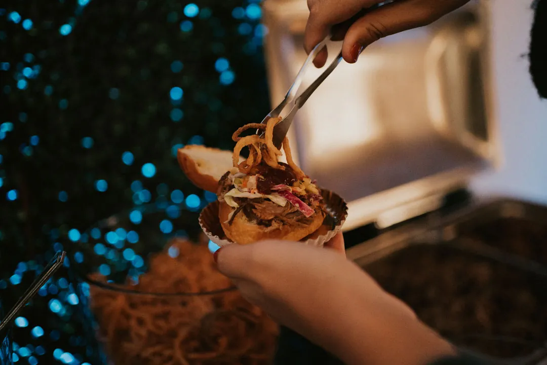 A chef serving a small plated dish