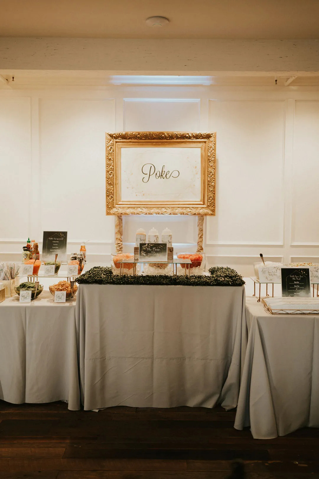 Catering table beneath a framed station sign