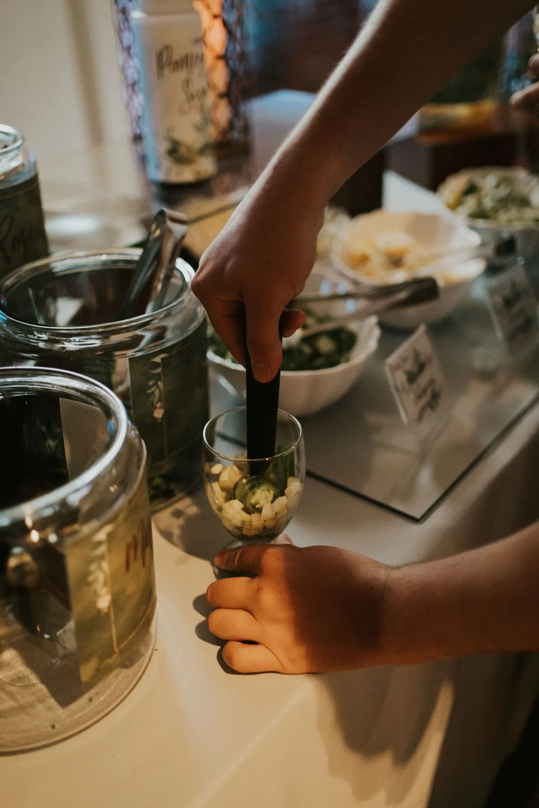 Server preparing an individual food portion