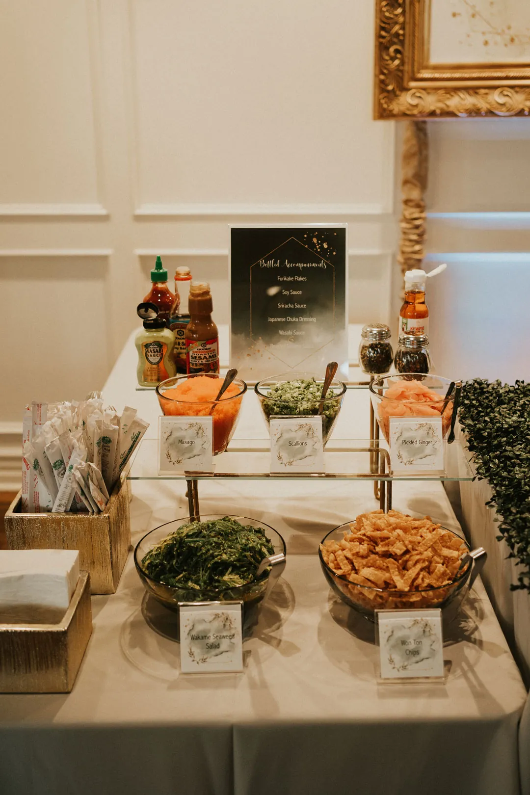 Food station with bowls and bottles of toppings
