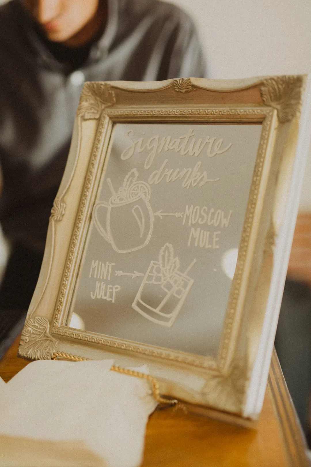Framed wedding sign displayed on a table