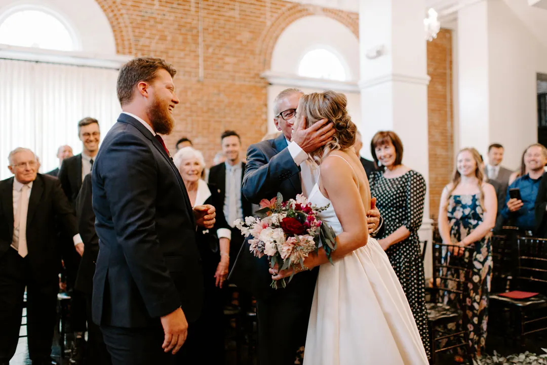 Bride and groom facing one another during the ceremony