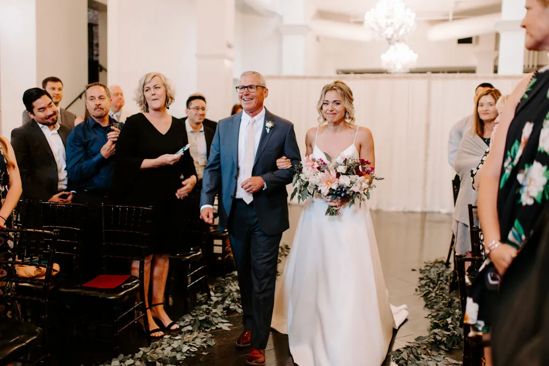Bride walking into the ceremony with an escort