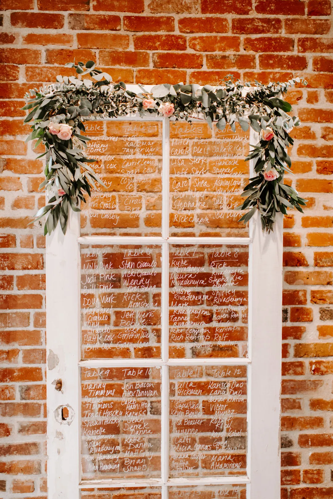 White window frame decorated with greenery
