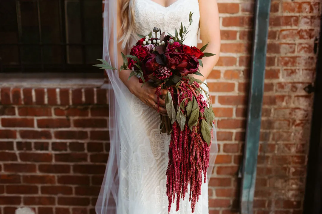 Cascading bouquet with deep red flowers