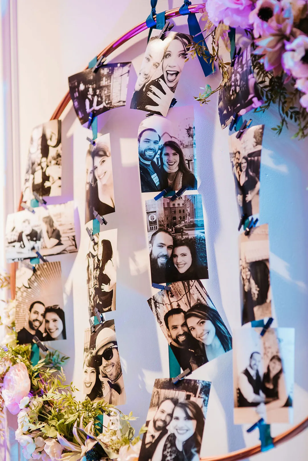 Photographs hang on a decorated display board.