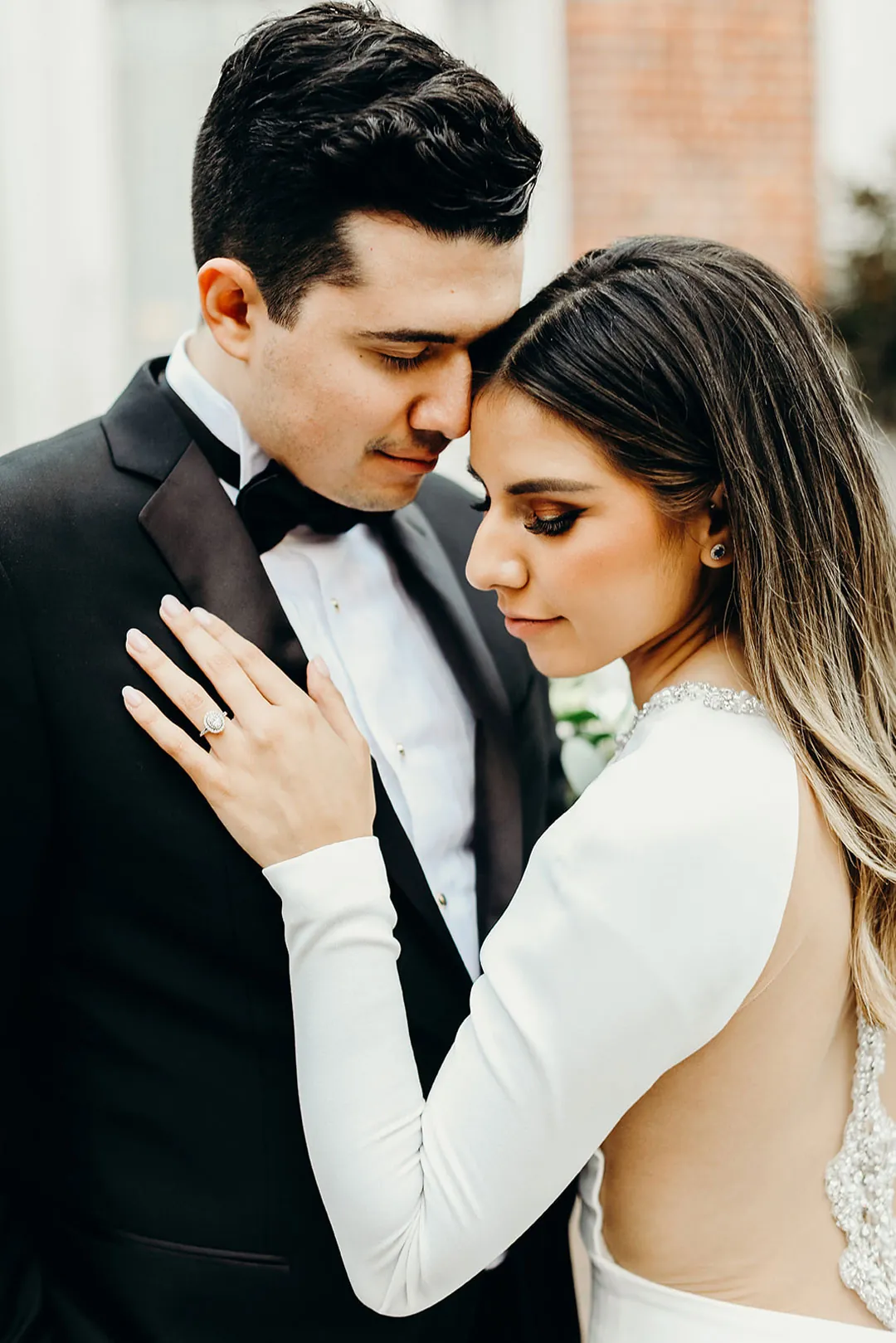 Couple embracing with their foreheads together