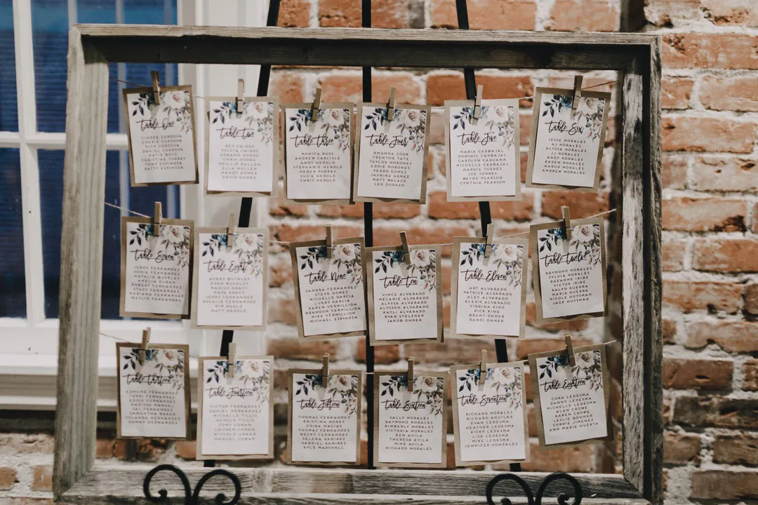 Cards arranged on a framed seating chart