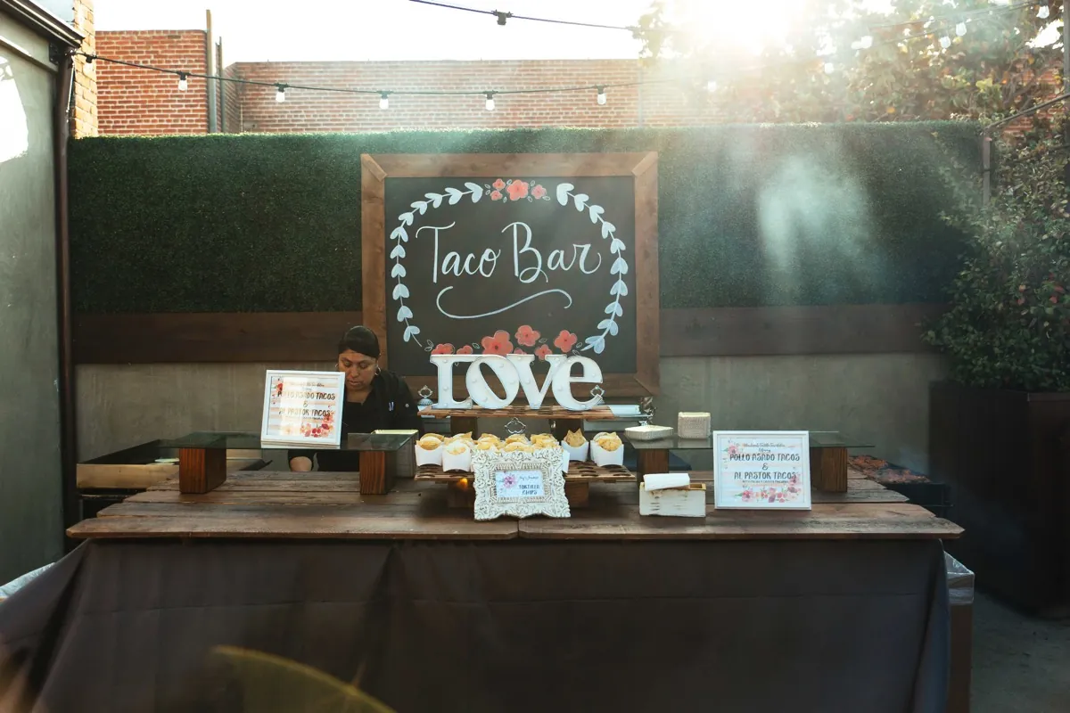 Outdoor taco station beneath string lights