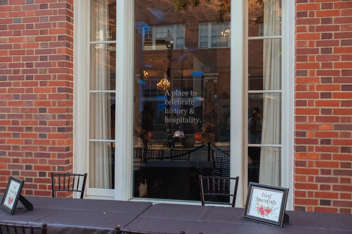 Event entrance with glass doors and brick walls