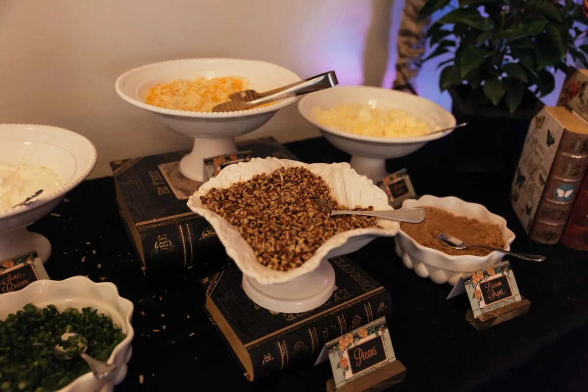 Serving bowls with mashed potatoes and assorted toppings
