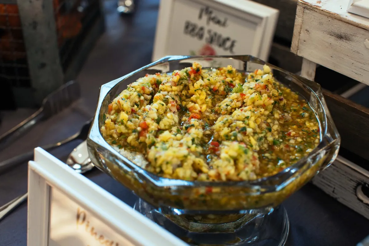 Large bowl of mixed grains and vegetables on a buffet