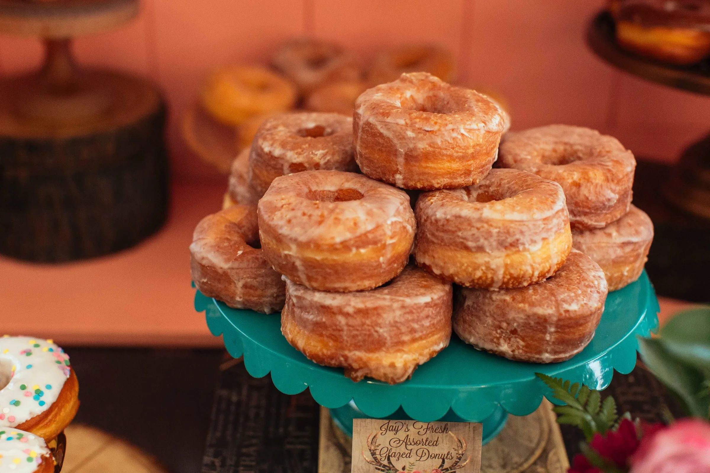 Stack of sugar-coated doughnuts on a dessert stand