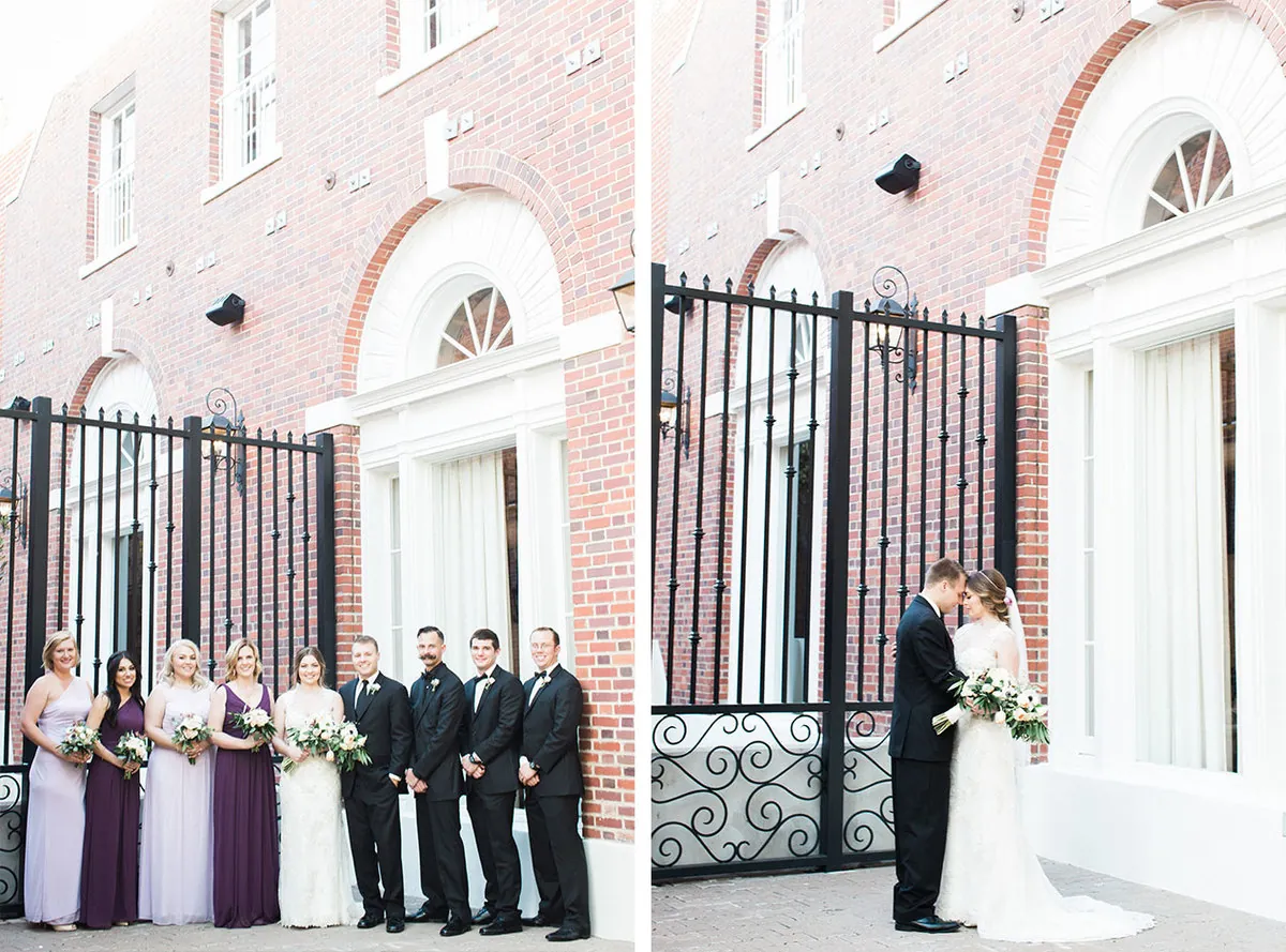 Wedding party outside a brick facade and the couple embracing