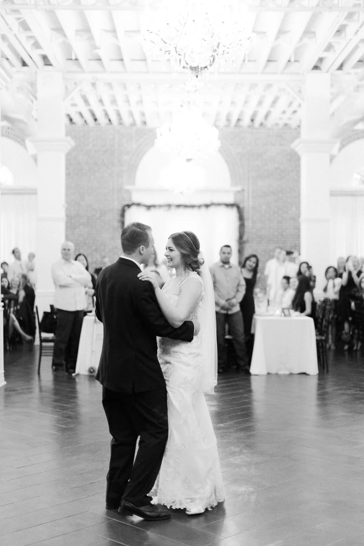 Black and white photo of a couple dancing in a ballroom