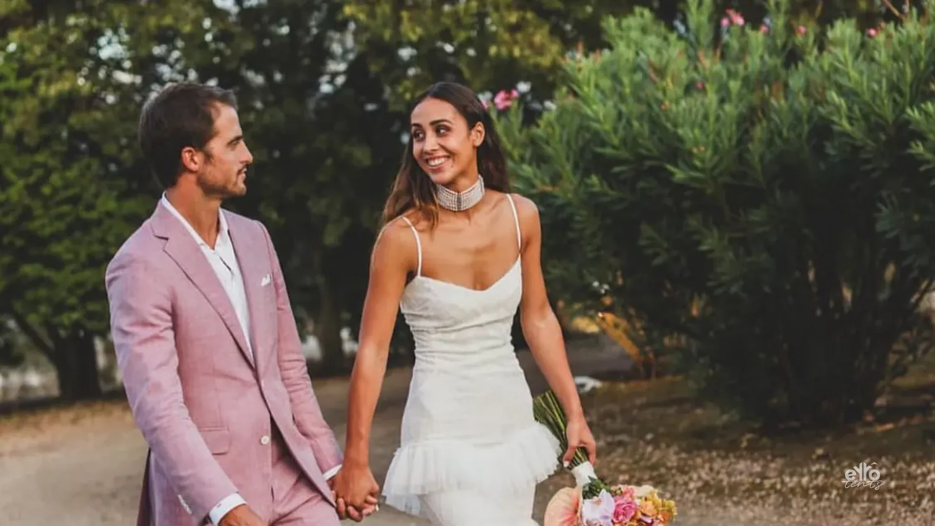 Bride and groom at a wedding with eyrô tents