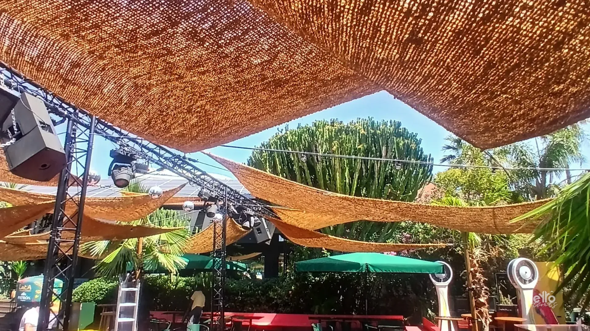 Woven shade canopy over an outdoor terrace