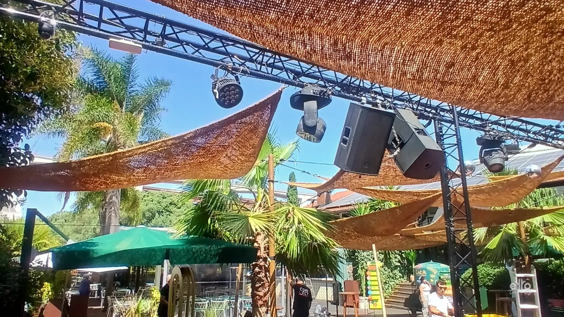 Woven shade over an outdoor bar area