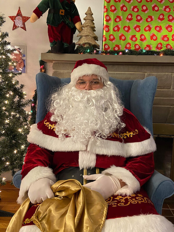 Santa holding a golden bag