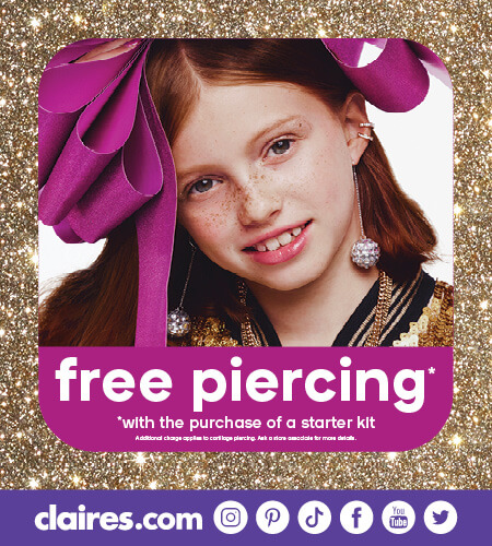 Young girl with large hair bow and three ear piercings