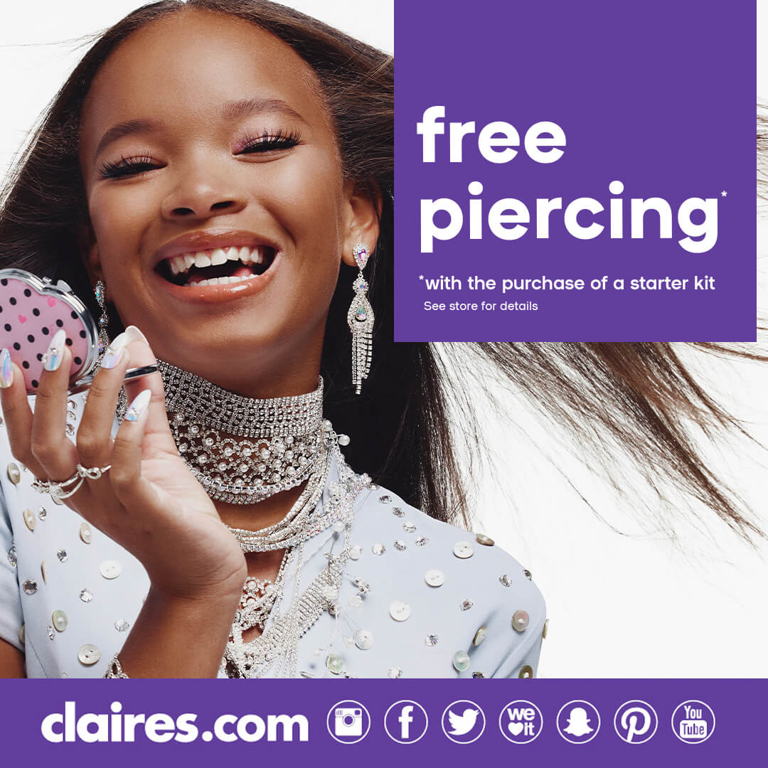 Young girl wearing Claire's jewelry smiling and holding a compact mirror.