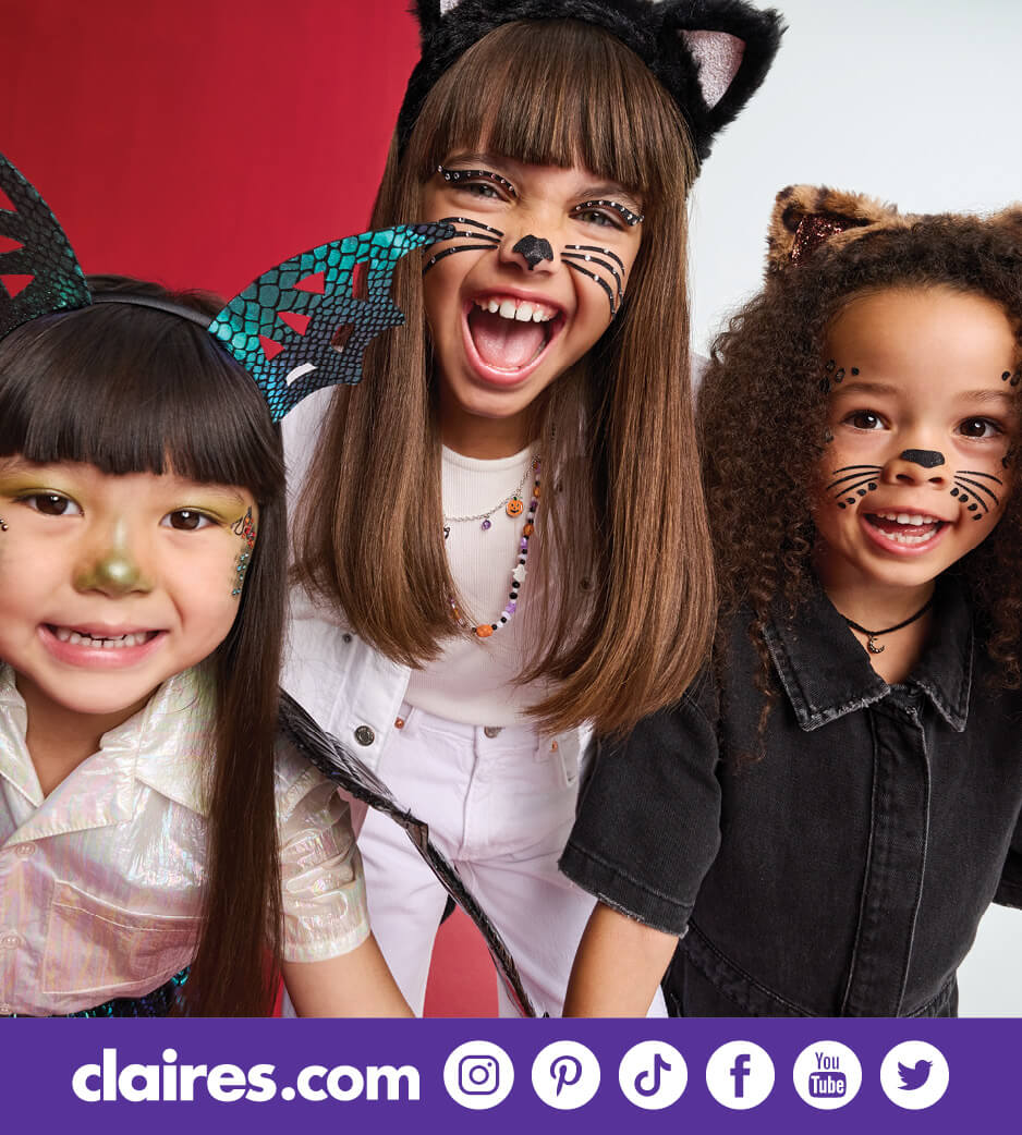 Three young girls in halloween costumes