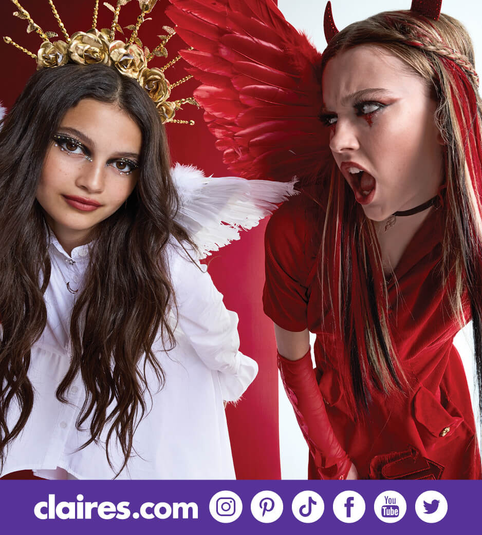 Two girls dressed up as an angel and a devil