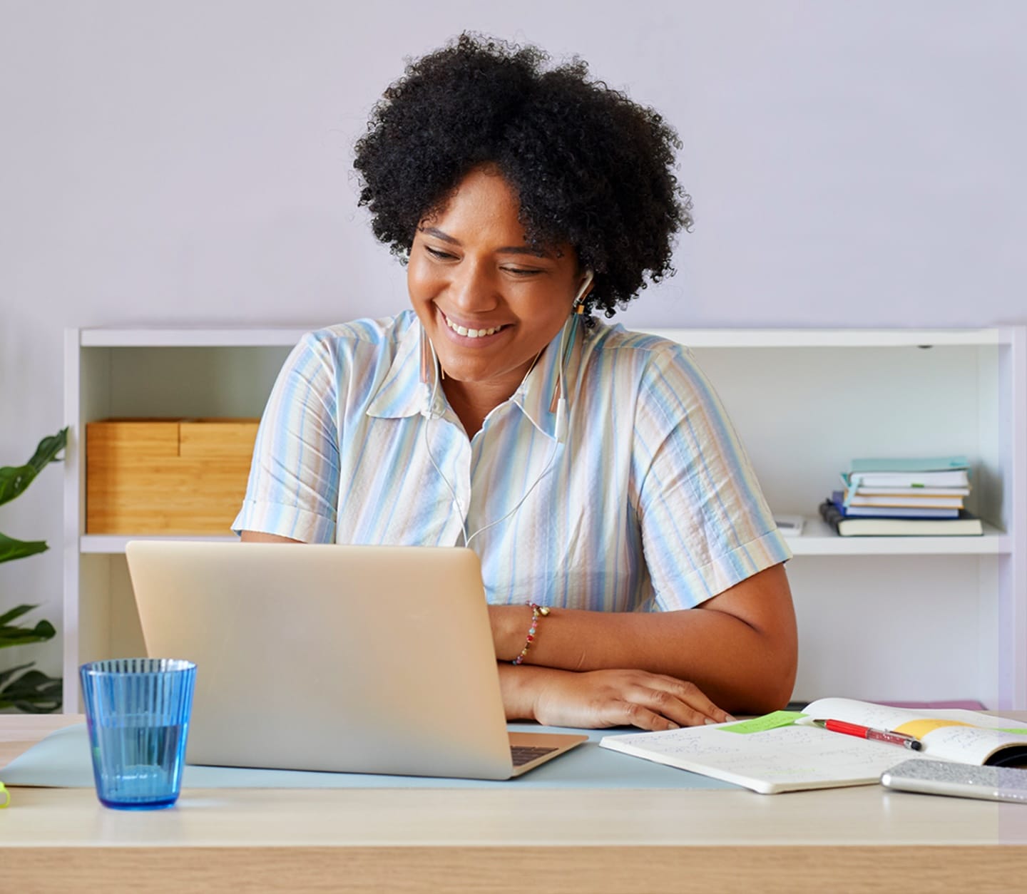 woman with headphones at her laptop