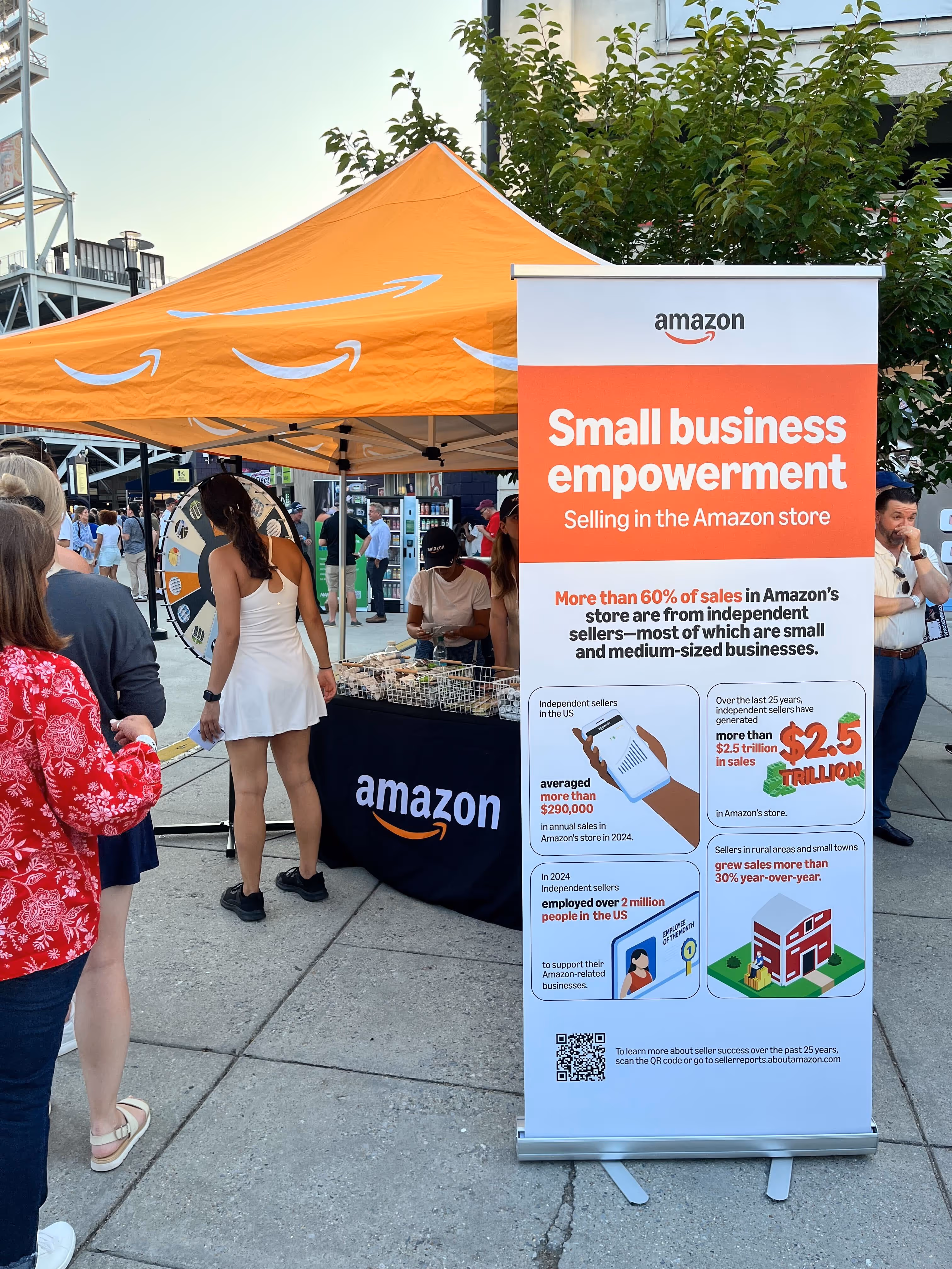 A tall banner at a busy event
