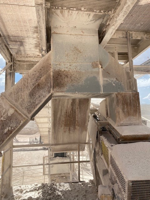 Diverter outlet chutes routing limestone to the screener feed conveyor