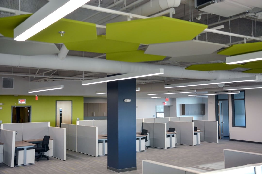open office space with hexagonal ceiling tiles
