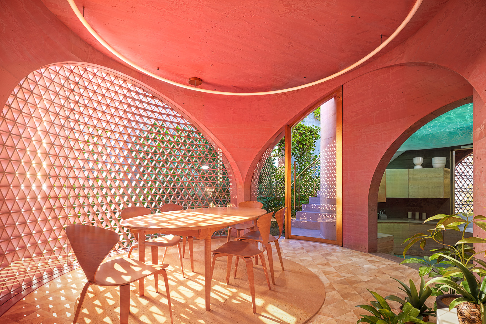 Dining room perspective of the Miami Beach House showing Platform 8 as a social room within the platformed interior.