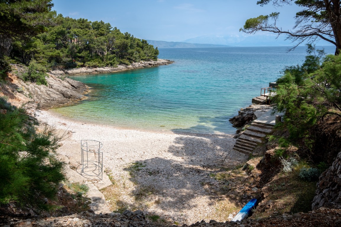 A small pebbly beach on an island