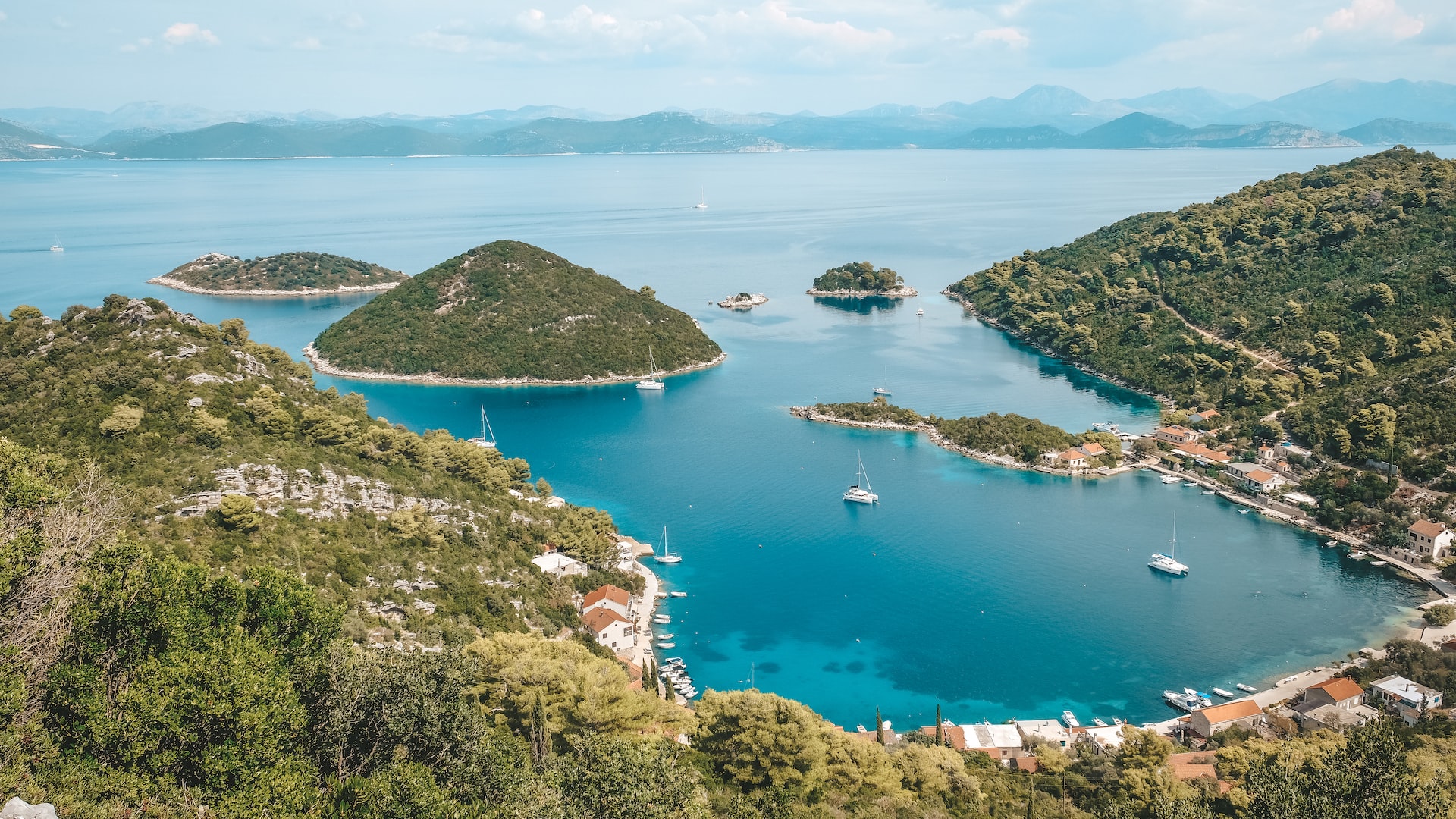 a look out point with many small green islands across the bay from mainland