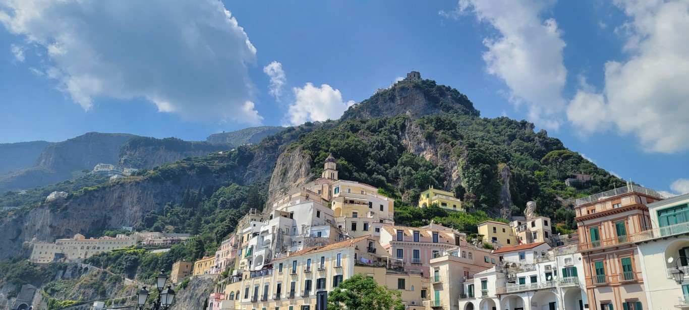 An upwards looking view of the buildings of Positano, Italy build up the steep mountain. 