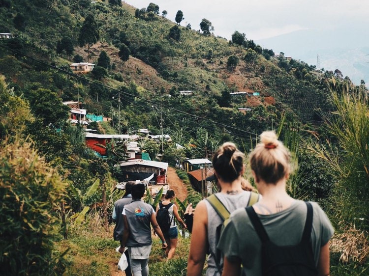 A group of foreigners on a hike in a rural community outside of Medellin