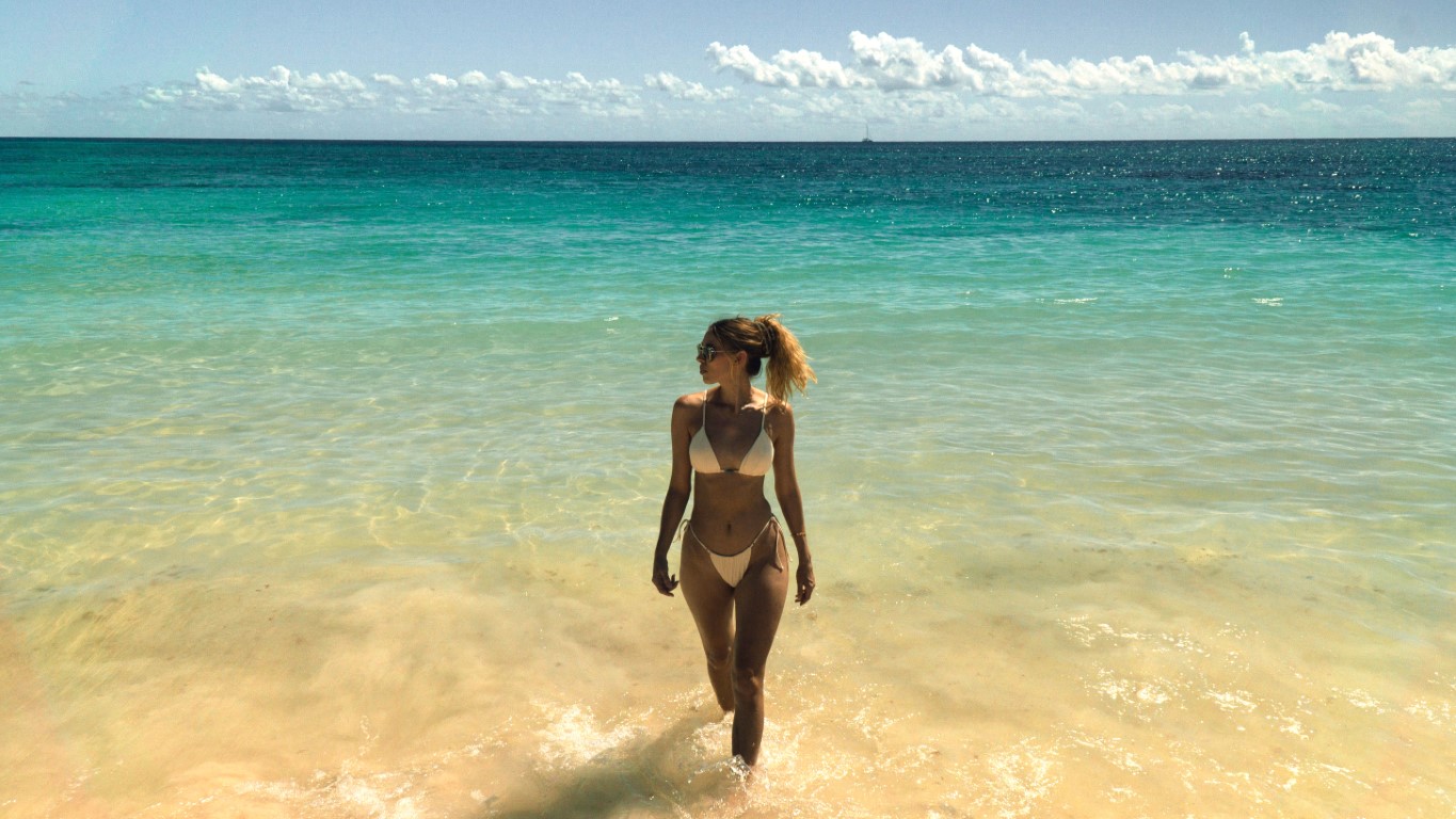 A woman who lives in Cancun posing in the Caribbean Sea in Mexico
